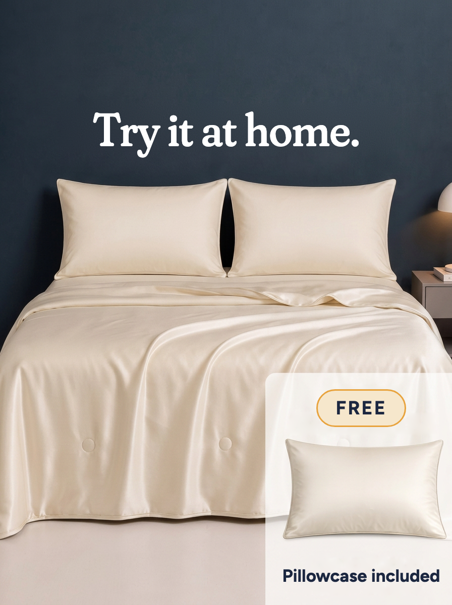 The Cooling Comforter in Frost Beige on a made bed · Try it at home · Free · Pillowcase included