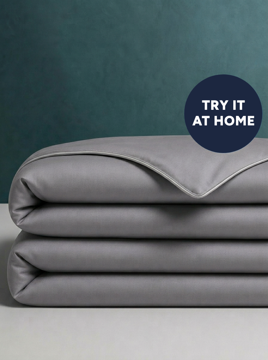 The Cooling Comforter in Frost Gray, folded · Try it at home