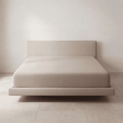 The Fitted Sheet in Cream on a mattress